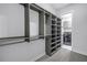 Spacious walk-in closet featuring shelving and convenient access to a laundry area at 2246 Fiesta Dr, Sarasota, FL 34231