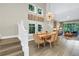 Dining room with modern lighting and view of the living room at 2246 Fiesta Dr, Sarasota, FL 34231