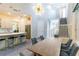 Open concept dining area featuring modern light fixture and staircase at 2246 Fiesta Dr, Sarasota, FL 34231