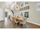 Elegant dining room with chandelier and staircase at 2246 Fiesta Dr, Sarasota, FL 34231