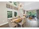 Open-concept with high ceilings, stylish chandelier, and views of the outdoors at 2246 Fiesta Dr, Sarasota, FL 34231