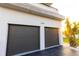 Home featuring a gray two-car garage for convenience and curb appeal at 2246 Fiesta Dr, Sarasota, FL 34231