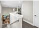 Bright hallway boasts wood floors, white trim, and offers an open view to the first floor at 2246 Fiesta Dr, Sarasota, FL 34231