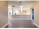 Open hallway with tile floors, white trim, and natural light from windows at 2246 Fiesta Dr, Sarasota, FL 34231
