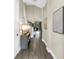 Inviting hallway with stylish tile flooring and elegant decor leading to the bright living area at 2246 Fiesta Dr, Sarasota, FL 34231