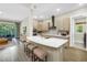 Open-concept kitchen with island, seating, and modern appliances at 2246 Fiesta Dr, Sarasota, FL 34231