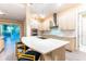 Modern kitchen with stainless steel appliances, a spacious island with bar seating, and sleek cabinetry at 2246 Fiesta Dr, Sarasota, FL 34231