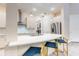 Stylish kitchen boasts stainless steel appliances, quartz countertops, and pendant lighting over a breakfast bar at 2246 Fiesta Dr, Sarasota, FL 34231