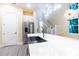 Bright kitchen features a large island with white countertop, stainless steel appliances, and modern pendant lighting at 2246 Fiesta Dr, Sarasota, FL 34231