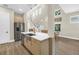 Bright kitchen features stainless steel appliances, white countertops, and a view of the staircase at 2246 Fiesta Dr, Sarasota, FL 34231
