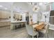 Open concept kitchen with modern appliances and a dining area at 2246 Fiesta Dr, Sarasota, FL 34231