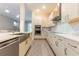 Contemporary kitchen with stainless steel appliances, quartz countertops, and ample cabinet space at 2246 Fiesta Dr, Sarasota, FL 34231