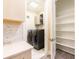 Well-equipped laundry room features modern washer and dryer units, ample shelving, and stylish backsplash at 2246 Fiesta Dr, Sarasota, FL 34231