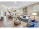 Bright and open living room featuring hardwood floors, contemporary decor, and ample natural light at 2246 Fiesta Dr, Sarasota, FL 34231