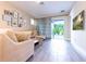 Comfortable living room with stylish decor and sliding glass doors leading to outdoor space at 2246 Fiesta Dr, Sarasota, FL 34231