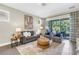 Cozy living room with stylish furniture and a view of the patio at 2246 Fiesta Dr, Sarasota, FL 34231