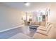 Spacious living room featuring modern tile floors and an open floor plan with lots of natural light at 2246 Fiesta Dr, Sarasota, FL 34231