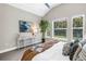 Bright main bedroom with neutral tones, vaulted ceiling, and a view of the outdoors at 2246 Fiesta Dr, Sarasota, FL 34231