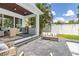 Outdoor patio with grill, dining, and lounge area perfect for entertaining at 2246 Fiesta Dr, Sarasota, FL 34231
