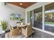 Covered patio with comfortable seating, a TV, and a view of the pool at 2246 Fiesta Dr, Sarasota, FL 34231