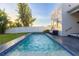Backyard featuring a pool and patio with a seating area for outdoor relaxation at 2246 Fiesta Dr, Sarasota, FL 34231