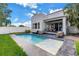 Backyard pool with contemporary outdoor furniture and patio area perfect for relaxing at 2246 Fiesta Dr, Sarasota, FL 34231