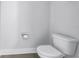 Clean and modern bathroom featuring a white toilet and minimalist design at 2246 Fiesta Dr, Sarasota, FL 34231