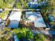 Aerial shot of the property showcasing the home, detached garage, and mature landscaping at 2514 Ohio S Ct, Gulfport, FL 33707