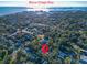 Aerial view of a residential area near Boca Ciega Bay with lush greenery and a red pin marking the property location at 2514 Ohio S Ct, Gulfport, FL 33707
