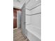 Bathroom featuring a tiled shower and bathtub with wood-look floors at 2514 Ohio S Ct, Gulfport, FL 33707