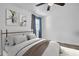 Primary bedroom featuring a plush bed with elegant gray and white tones at 2514 Ohio S Ct, Gulfport, FL 33707