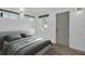 Bright bedroom with neutral tones, wood-look flooring, and well-lit windows, creating a relaxing atmosphere at 2514 Ohio S Ct, Gulfport, FL 33707
