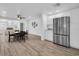 Open kitchen layout features stainless steel refrigerator and modern white cabinetry at 2514 Ohio S Ct, Gulfport, FL 33707