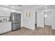 Spacious kitchen featuring stainless steel refrigerator, modern countertops and white cabinets at 2514 Ohio S Ct, Gulfport, FL 33707