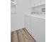 Laundry room equipped with a washer and dryer, and hardwood floors at 2514 Ohio S Ct, Gulfport, FL 33707