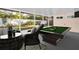 Well decorated sunroom, with a pool table and comfortable seating at 2514 Ohio S Ct, Gulfport, FL 33707