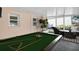 Sunroom featuring a pool table and comfortable furniture at 2514 Ohio S Ct, Gulfport, FL 33707
