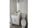 Compact bathroom featuring a modern vanity, faucet, and toilet, maximizing space at 27466 Us Highway 19 N # 97, Clearwater, FL 33761