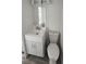 Compact bathroom featuring a modern vanity, mirror, and toilet at 27466 Us Highway 19 N # 97, Clearwater, FL 33761