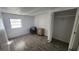 Cozy bedroom featuring modern wood-look floors, neutral walls, and closet at 27466 Us Highway 19 N # 97, Clearwater, FL 33761