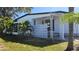 Attractive home exterior with mature landscaping and pleasant curb appeal at 27466 Us Highway 19 N # 97, Clearwater, FL 33761