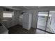 Well-equipped kitchen with white cabinetry, modern appliances, and countertop space at 27466 Us Highway 19 N # 97, Clearwater, FL 33761