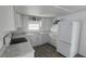 Well-equipped kitchen with white cabinetry, modern appliances, and countertop space at 27466 Us Highway 19 N # 97, Clearwater, FL 33761