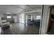 Open-concept living room and kitchen area with dining table and attractive flooring at 27466 Us Highway 19 N # 97, Clearwater, FL 33761