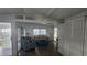 Bright living room with wood-look floors, neutral walls, and comfortable seating arrangement at 27466 Us Highway 19 N # 97, Clearwater, FL 33761