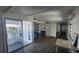 Living area with a view of porch, kitchen, and dining table at 27466 Us Highway 19 N # 97, Clearwater, FL 33761