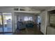 Bright living room featuring an open layout, wood floors, and a washer and dryer at 27466 Us Highway 19 N # 97, Clearwater, FL 33761
