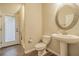Bathroom featuring a pedestal sink, tiled floors and bright natural light at 3815 Gaviota Dr, Sun City Center, FL 33573