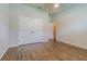 Neutral bedroom completed with wood floors and a double-door closet offering great storage space at 3815 Gaviota Dr, Sun City Center, FL 33573