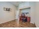 Bedroom includes desk, chair, storage and ceiling fan at 3815 Gaviota Dr, Sun City Center, FL 33573